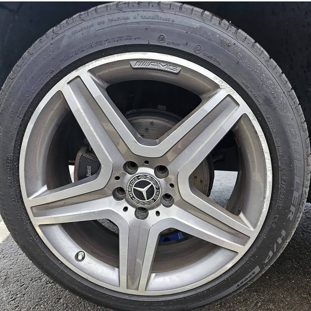 Alloy wheel with diamond cut damage before repair